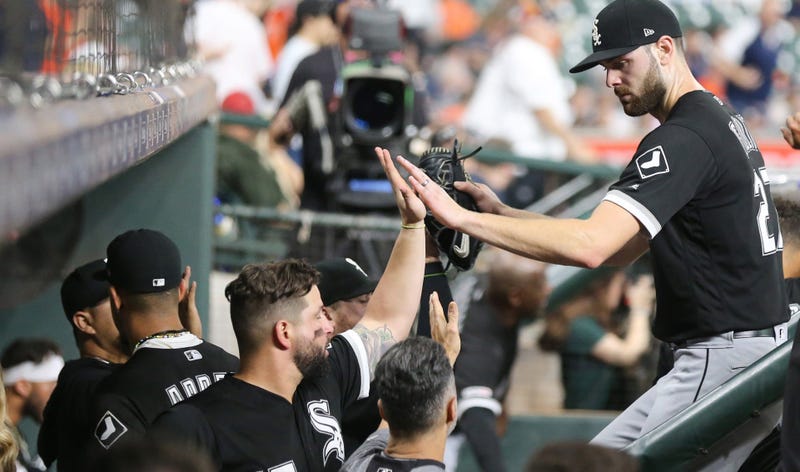 White Sox right-hander Lucas Giolito, right, receives congratulations from teammates.