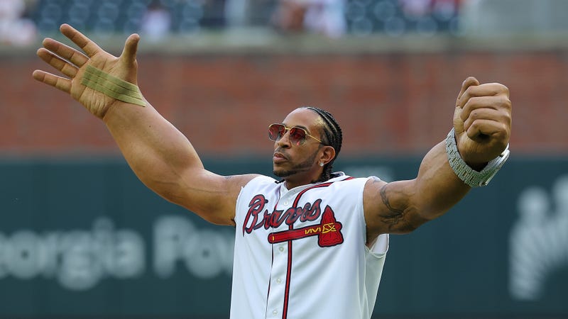  Rapper Ludacris reacts after throwing out the first pitch prior to the game between the Atlanta Braves and the Colorado Rockies at Truist Park on September 04, 2024 in Atlanta, Georgia. 