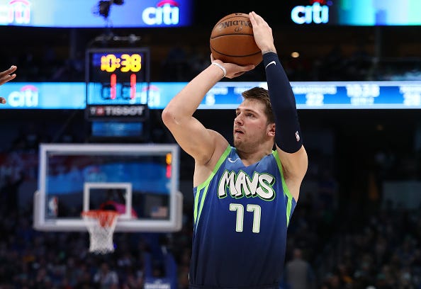 Luka Doncic unleashes a shot from beyond the arc. 