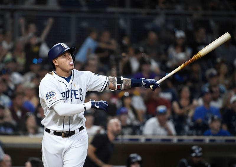 Manny Machado watches as he skies a ball toward the seats for the Padres. 