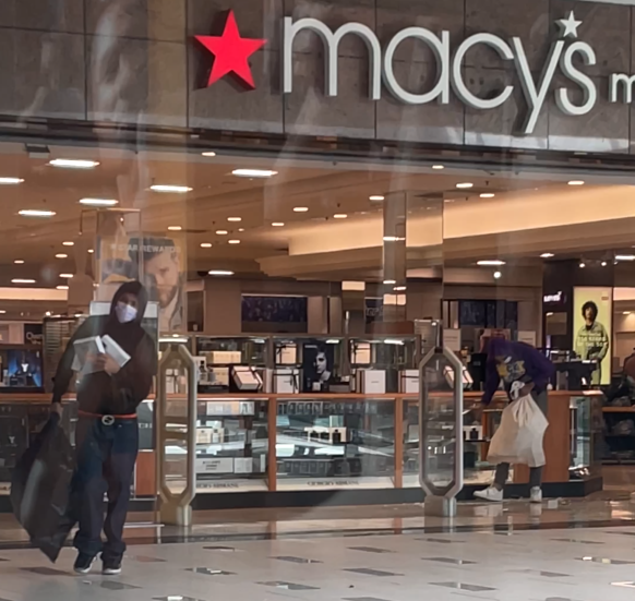 Authorities are searching for a group of men involved in a smash-and-grab at a Macy’s in Northridge.