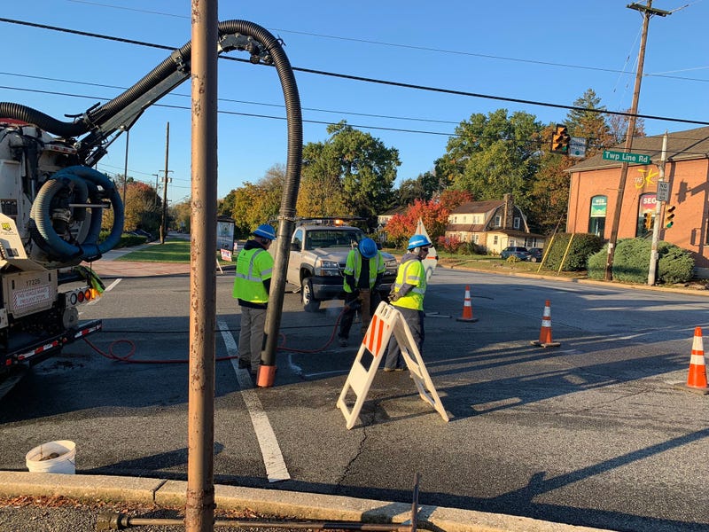 Crews from Pennsylvania American Water dig in the street on Township Line Road near Dekalb Pike in Whitpain Township, Montgomery County, the site of an overnight water main break.