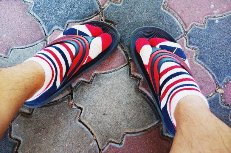 Man in Socks & Flip Flops