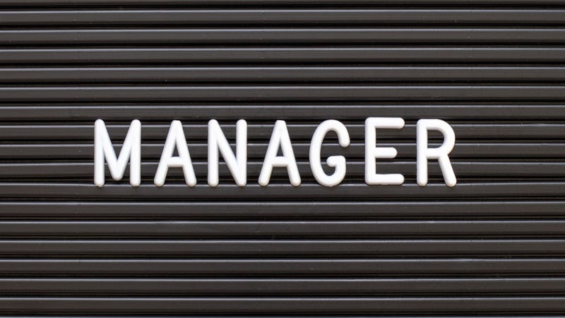 Black color felt letter board with white alphabet in word manager background - stock photo