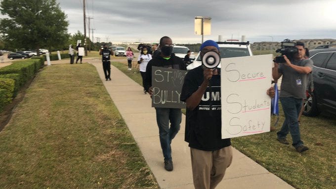 Demonstrators outside Timberview call for metal detectors at all schools
