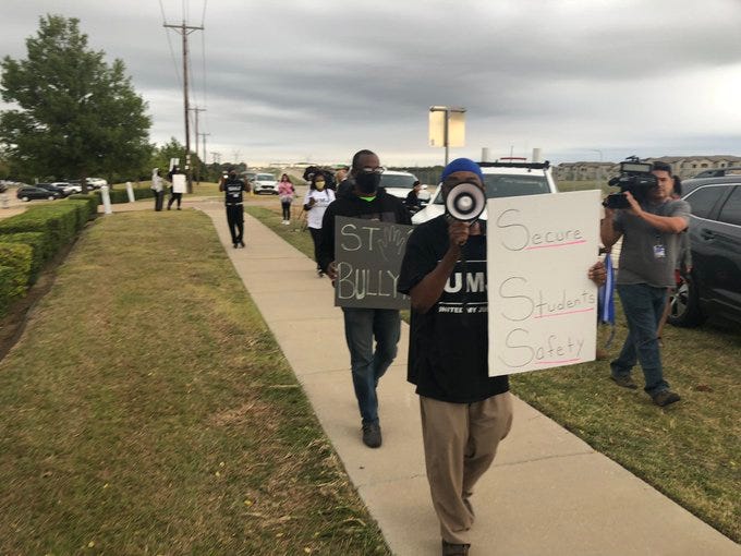 Demonstrators outside Timberview call for metal detectors at all schools