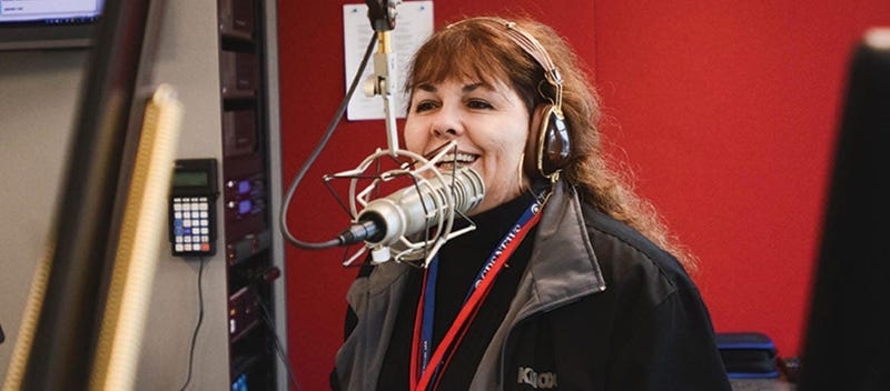 Maria Keena behind a mic