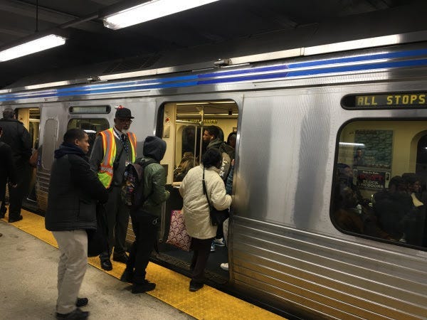 People boarding the Market Frankford Line.
