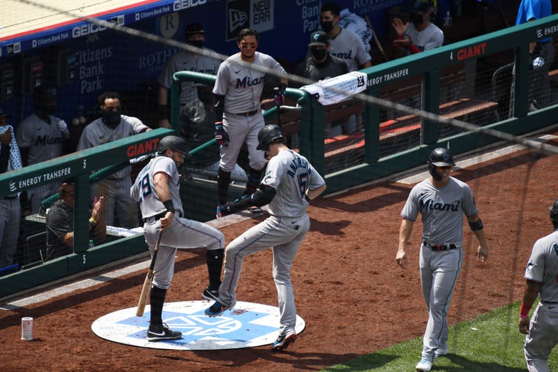 Marlins players celebrate after a home run on July 26