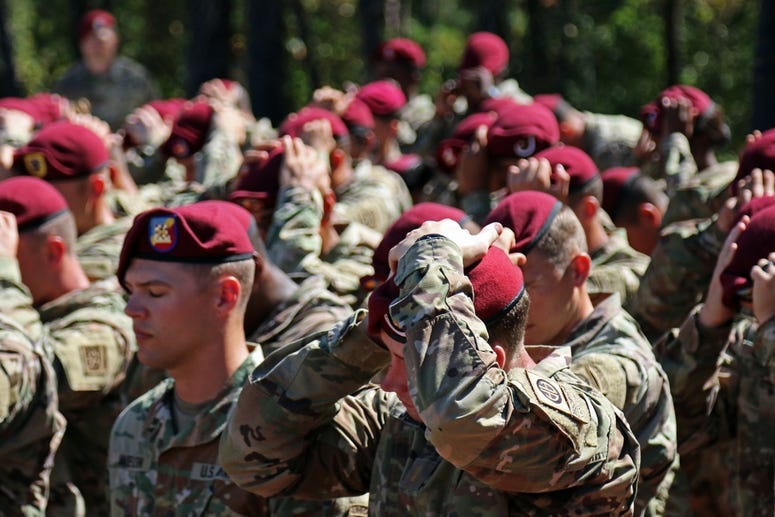82nd Airborne soldiers don their maroon beret