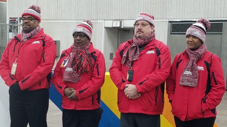 MARTA Police Officers and Transit Ambassadors shown in high-visibility Super Bowl attire