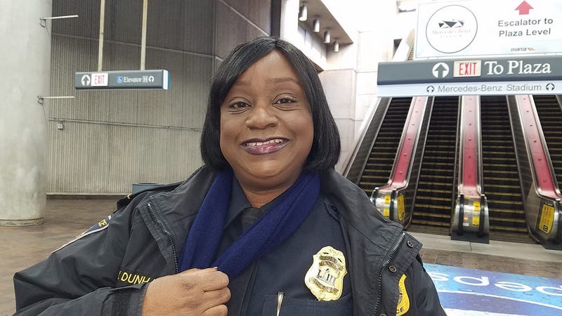 MARTA Chief Wanda Dunham proudly shows special Super Bowl LIII badge