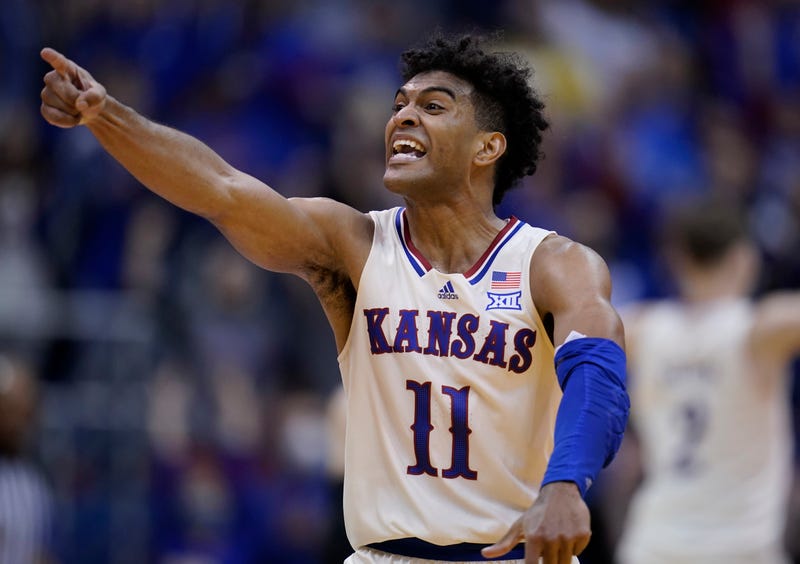 LAWRENCE, KANSAS - DECEMBER 18: Remy Martin #11 of the Kansas Jayhawks celebrates hitting a basket against the Stephen F. Austin Lumberjacks in the second half at Allen Fieldhouse on December 18, 2021 in Lawrence, Kansas.