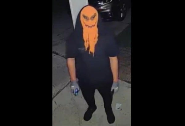 man in a creepy orange mask