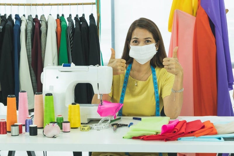 woman sewing masks