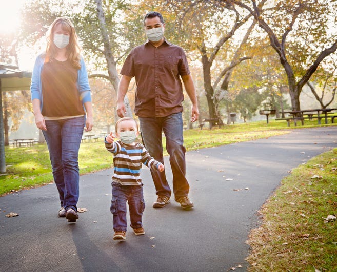 family wearing face masks