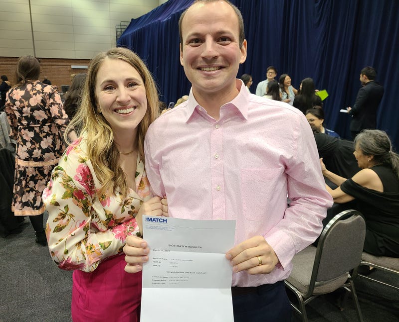 Match Day couple with letter