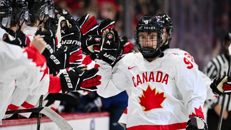 Gavin McKenna #9 of Team Canada celebrates his goal with teammates on the bench during the first period at the 2025 IIHF World Junior Championship against Team Finland at Canadian Tire Centre December 26, 2024 in Ottawa, Ontario, Canada.