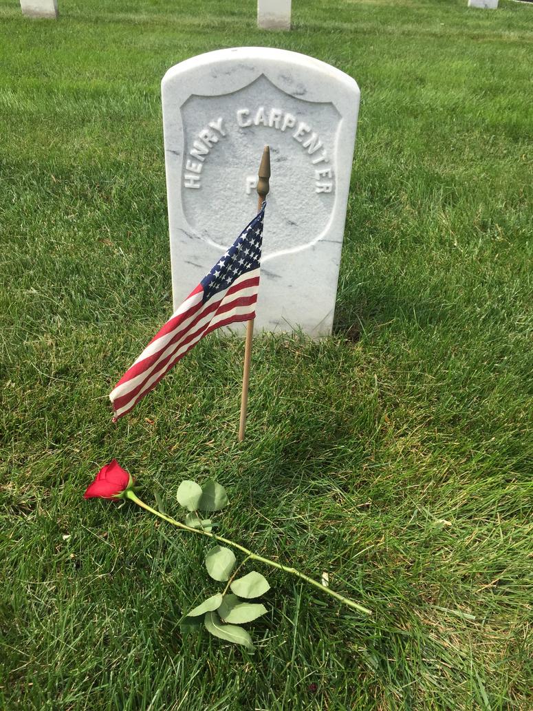 Memorial Day Flowers volunteers place flowers on the graves of veterans