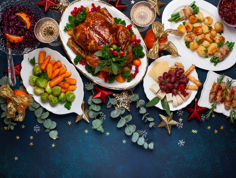 Christmas dinner with roasted chicken and various vegetables dishes