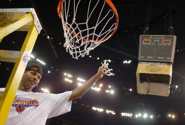 Carmelo Anthony cuts down the nets for Syracuse.