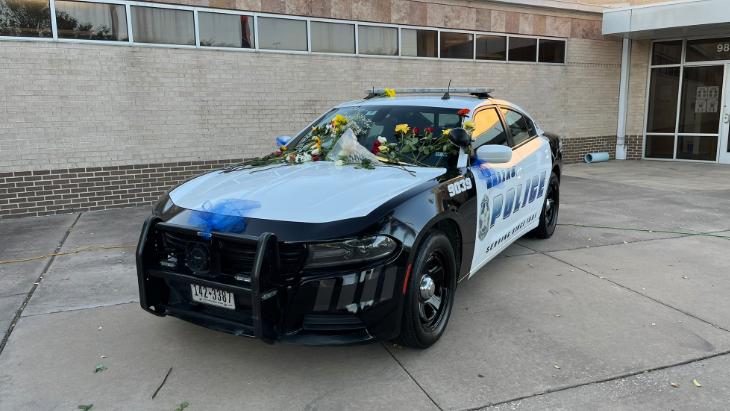 Squad car parked at Dallas Police Northwest Patrol station for Arellano memorial