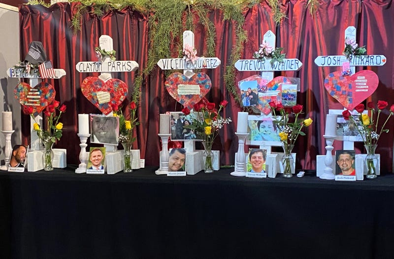 photos and crosses of the five victims