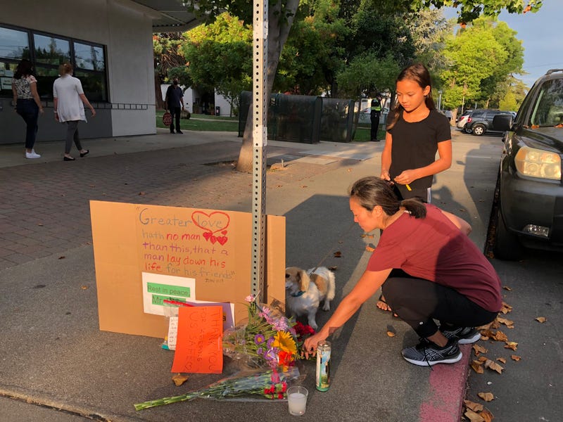 A memorial is growing for a fallen crossing guard outside a Lafayette school.