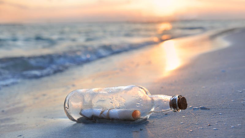 Message in bottle on sandy shore