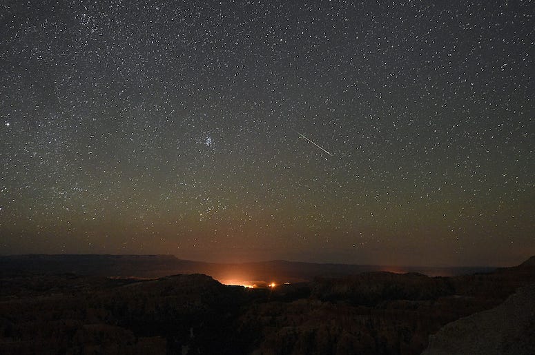 Perseid meteor shower takes place over night sky in Utah.