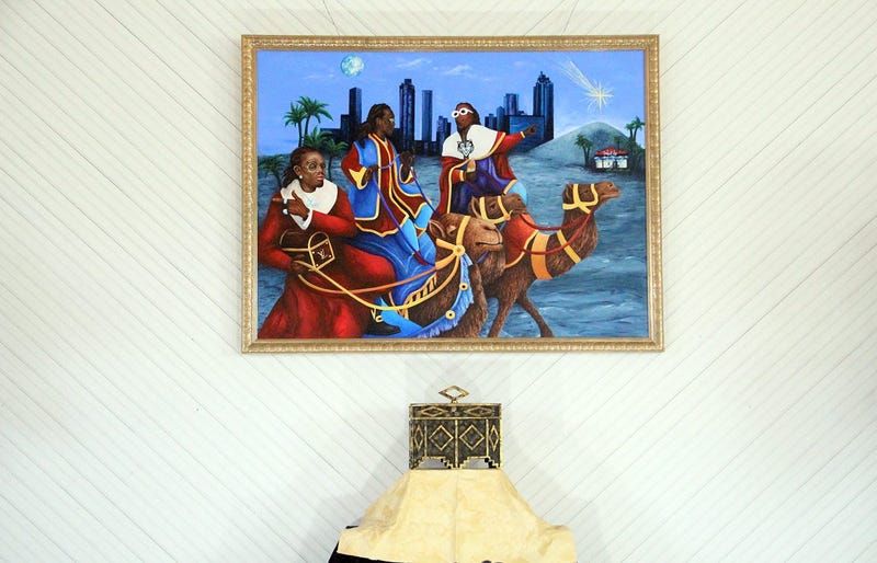 A painting of Migos as the Three Wise Men headed to Magic City at the TRAP CHAPEL pop-up art gallery in Atlanta