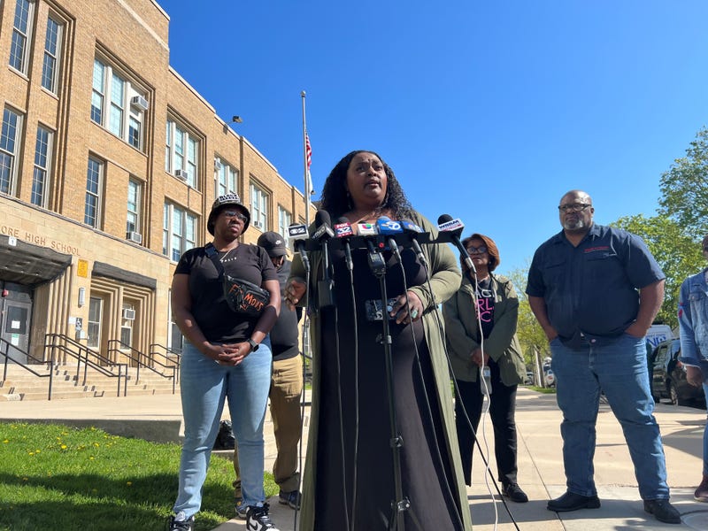 migrant news conference outside high school