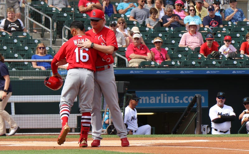 Kolten Wong and Mike Shildt hug.