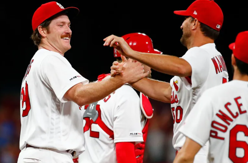 Miles Mikolas celebrates with Cardinals teammates