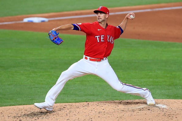 Mike Minor pitches for the Rangers. 
