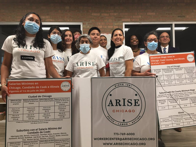 Arise Chicago organizers educate workers on new Illinois minimum wage increase