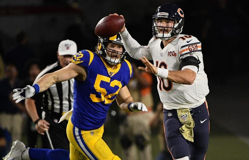 Bears quarterback Mitchell Trubisky (10) throws a pass as he's chased by Rams outside linebacker Clay Matthews.