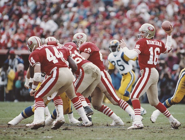 Joe Montana drops back to pass for the 49ers.