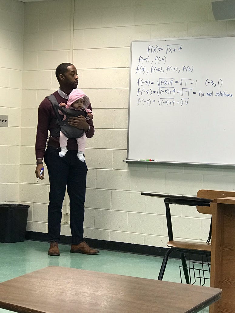 Morehouse visiting professor Nathan Alexander lent a hand to a student who brought his baby to class.