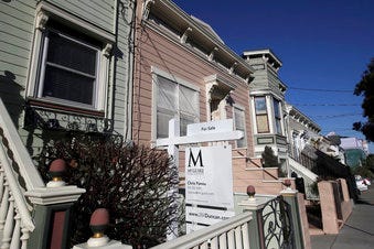 This Feb. 18, 2020, photo shows a real estate sign in front of a home for sale in San Francisco. On Thursday, Feb. 27, Freddie Mac reports on this week’s average U.S. mortgage rates. (AP Photo/Jeff Chiu)