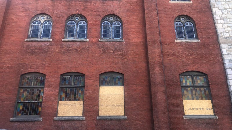 Mother Bethel AME Church exterior, with the damaged stained glass windows boarded up