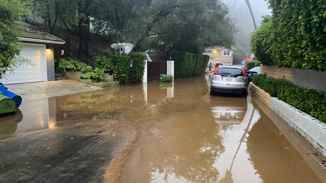 Flooding, mudslides close roads and hiking trails, cause sinkhole