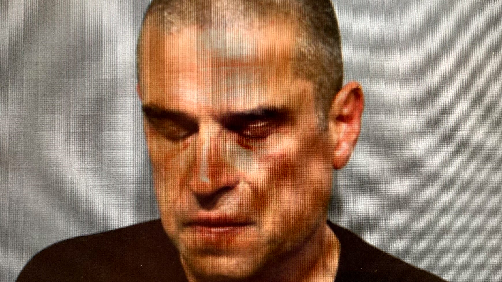 Suspect charged in ax attack at suburban parking garage