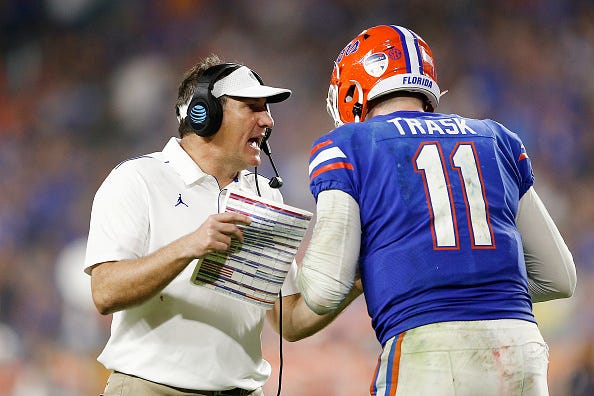 Dan Mullen talks with Florida QB Kyle Trask.