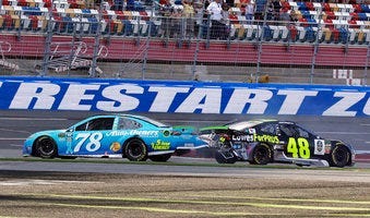 FILE - In this Sept. 30, 2018, file photo, Martin Truex Jr., (78) and Jimmie Johnson (48) crash on the final lap during the NASCAR Cup series auto race at Charlotte Motor Speedway in Concord, N.C.(AP Photo/Chuck Burton, File) 