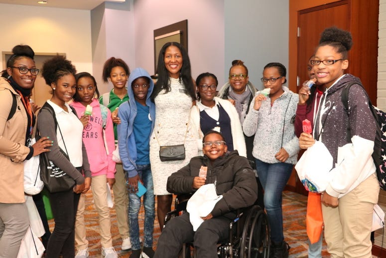 Fulton Commissioner Natalie Hall is shown with teens during a previous CEO's conference