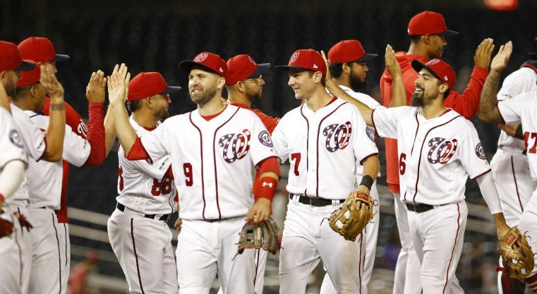 The Nationals celebrate a win over the Rockies Wednesday night. 