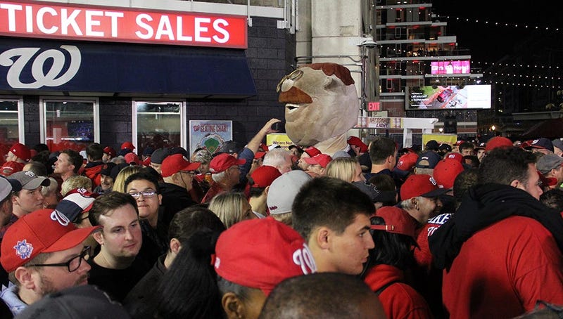 Teddy, one of the Racing President's at Nationals Park, walks the crowded concourse at Nationals Park during Game 4 of the World Series.