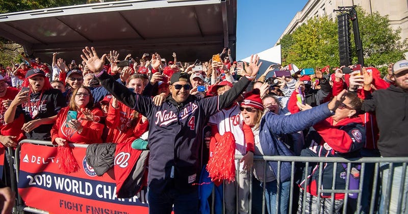 Washington Nationals players and coaches roll through the streets of Washington, D.C. and then speak on stage, celebrating their 2019 World Series championship with a few hundred thousand fans on November 2, 2019. 