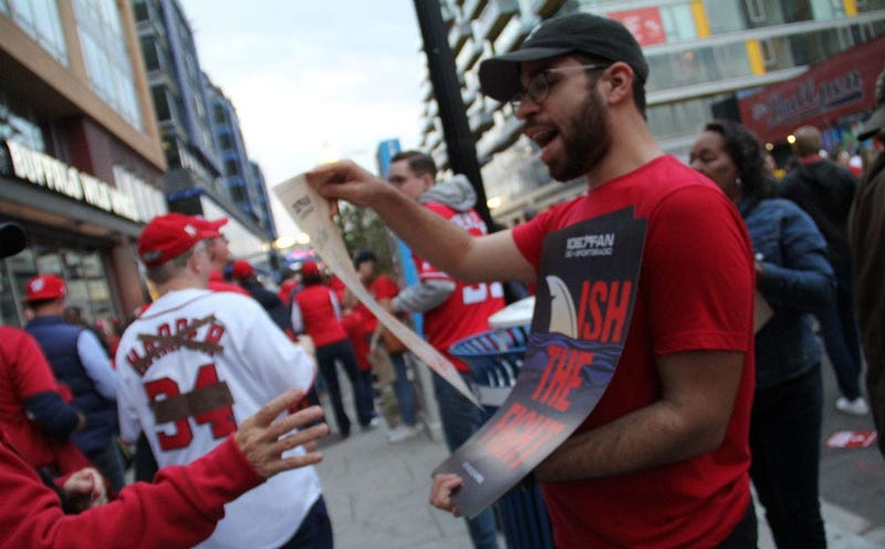 "Finish the Fight" cards were handed out to baseball fans ahead of Game 3 of the World Series in D.C.